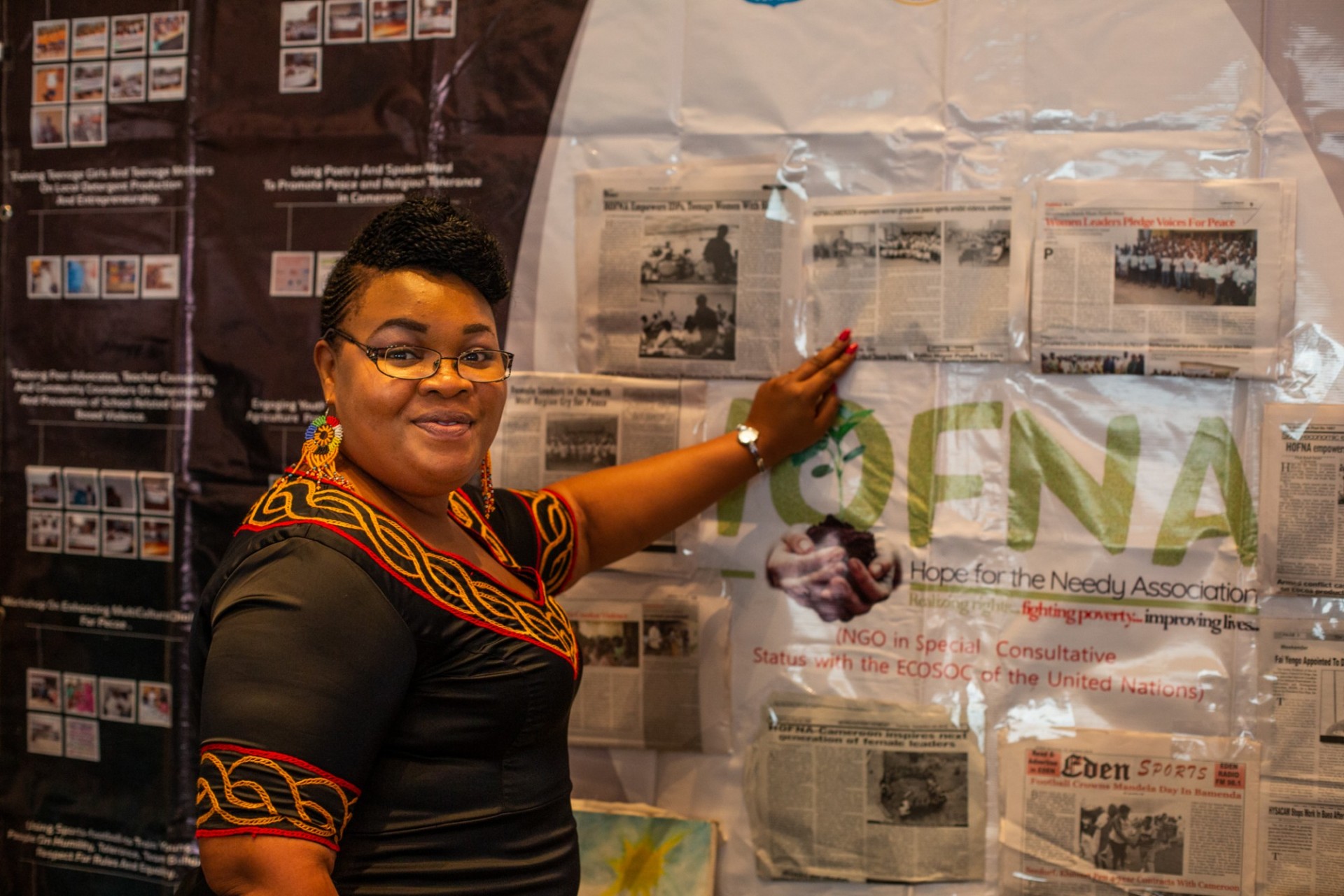 Woman with Peace wall who was a participant in the Fellowship program in Nairobi, Kenya