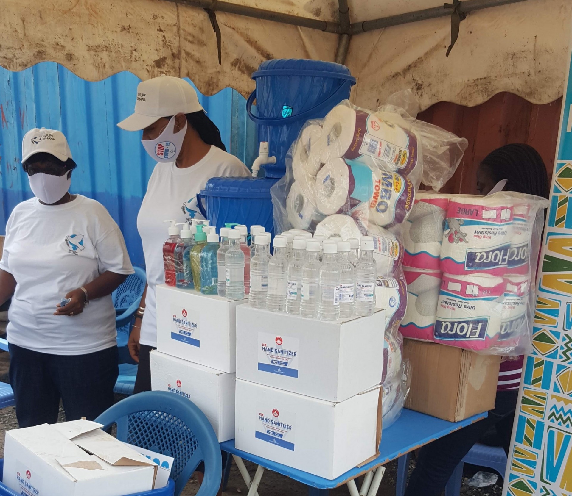 Margaret Sedziafa (left) and Ayo Ayoola-Amale, leaders from the Women’s International League for Peace and Freedom Chapter in Ghana, distribute supplies in Tema, a suburb of Accra. Photo: Margaret Sedziafa