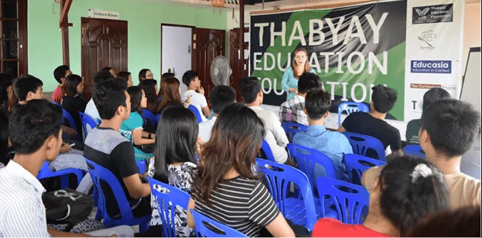 Graduate student fellow doing a presentation during fieldwork. 