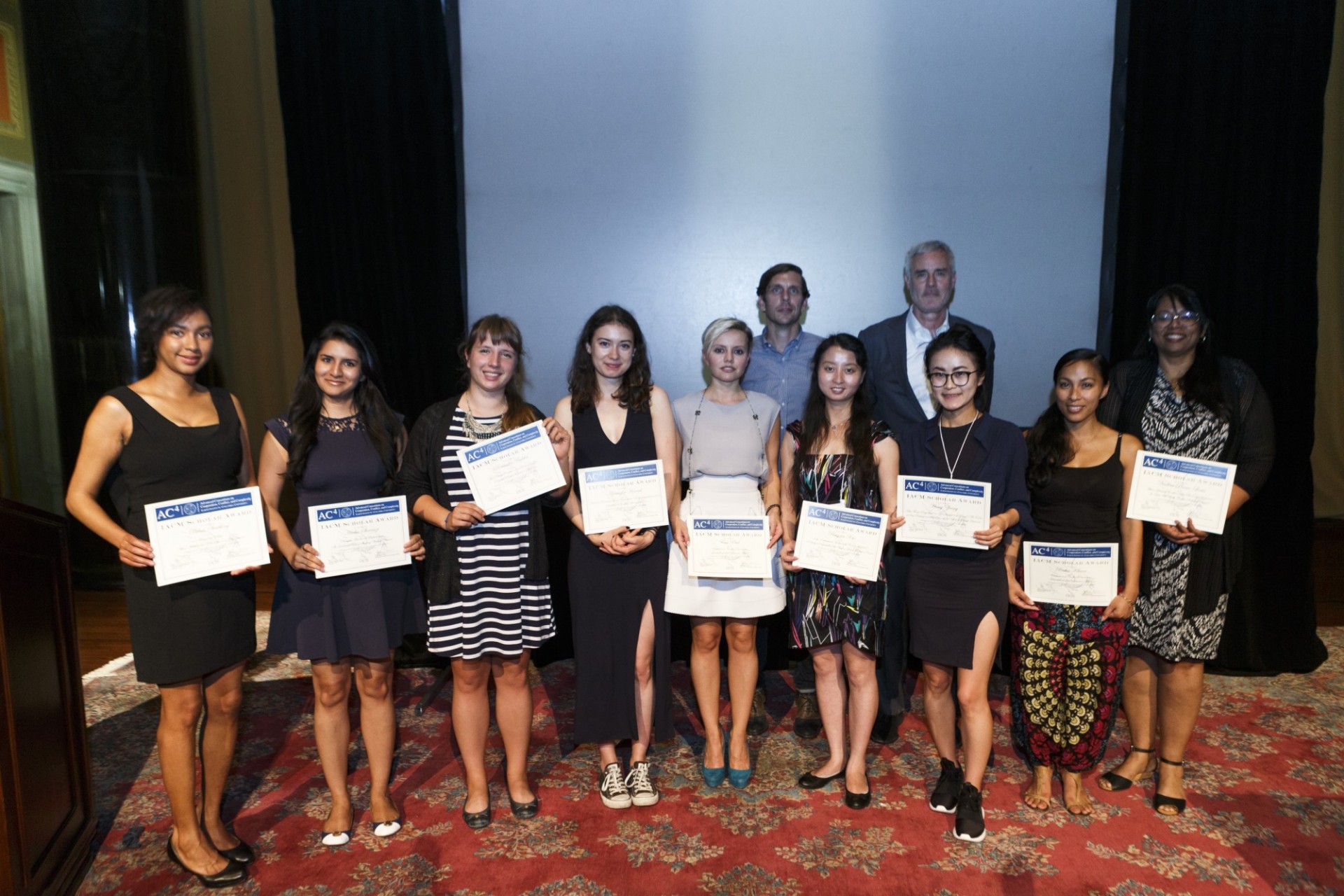 Group photo of IACM recipients receiving certificates at the closing ceremony